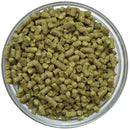 Erebus hop pellets in a glass bowl on a white background