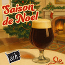 Glass of dark beer with 'Saison de Noel' text and Christmas tree in background