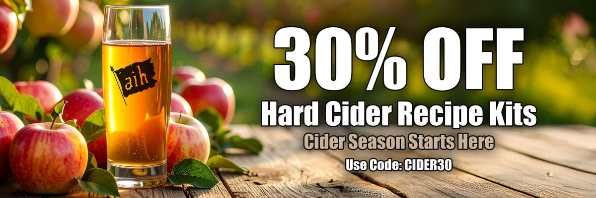 Promotional banner for hard cider recipe kits with a glass of cider and apples on a wooden table.
