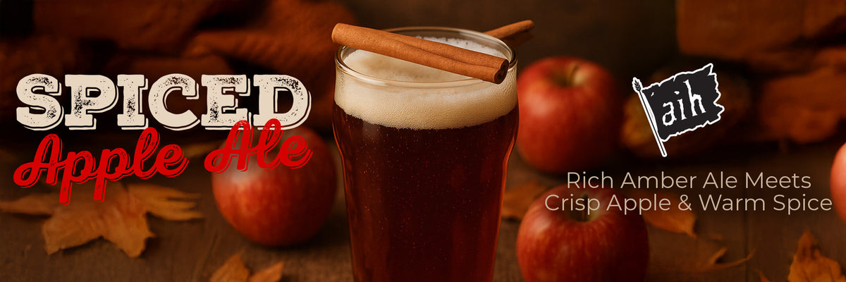 Spiced Apple Ale with cinnamon stick and apples on a wooden background