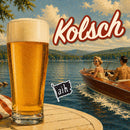 Glass of Kolsch beer with a scenic lake and boat in the background with the words Kolsch overtop
