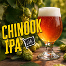 Glass of Chinook IPA with hops in the background