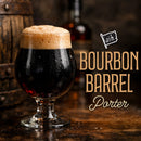 Glass of bourbon barrel porter with wooden barrel and bottle in the background