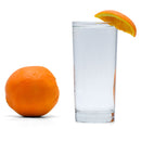 A refreshing glass of Navel Orange Hard Seltzer with an orange wedge beside it.