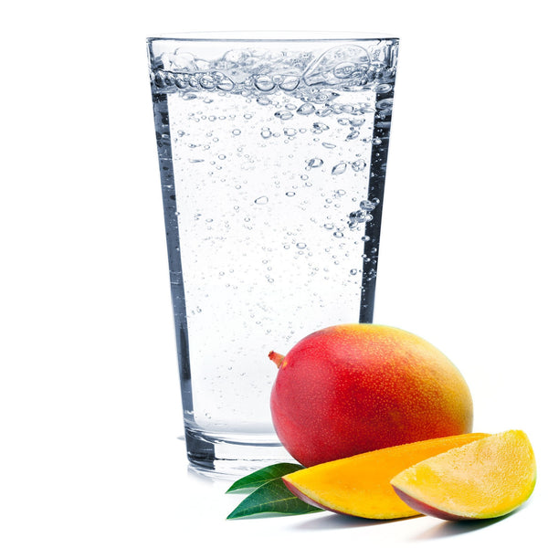 A glass of Mango Hard Seltzer with a ripe mango slice on the rim.