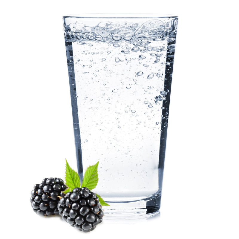 A deep-colored Blackberry Hard Seltzer with fresh blackberries by the glass.