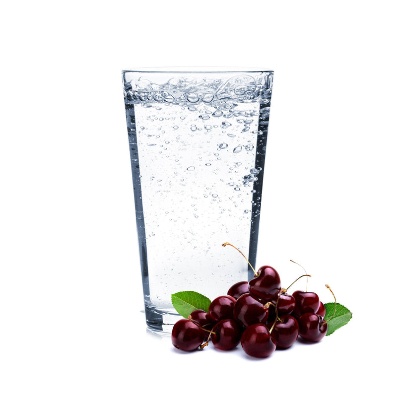 A bold glass of Black Cherry Hard Seltzer with fresh cherries beside it.