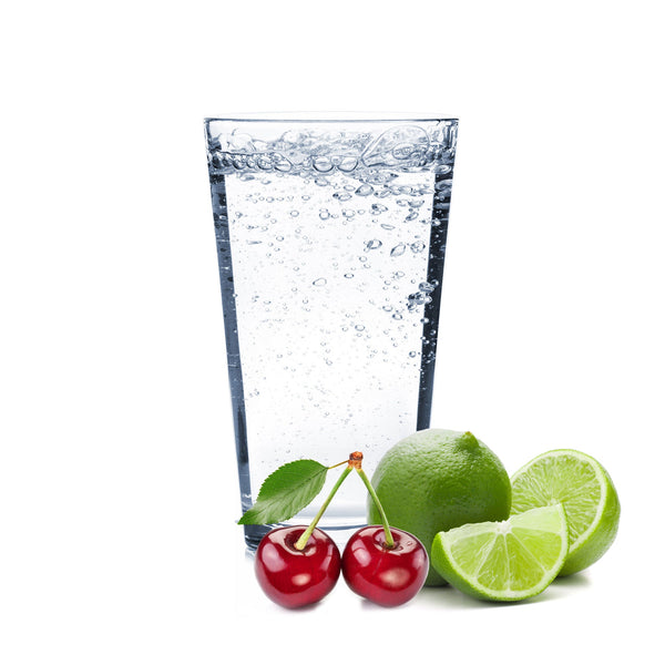 A glass of Cherry Lime Hard Seltzer with cherries and lime wedges on the side.