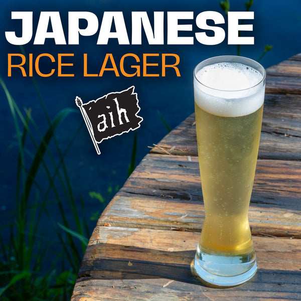 Glass of Japanese rice lager on a wooden surface with 'aih' branding.
