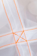 Close-up of white fabric with orange stitching