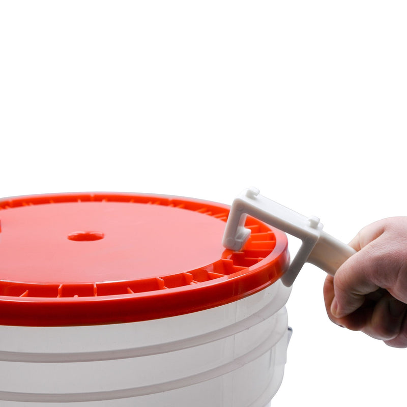 The plastic bucket opener opening a plastic bucket lid