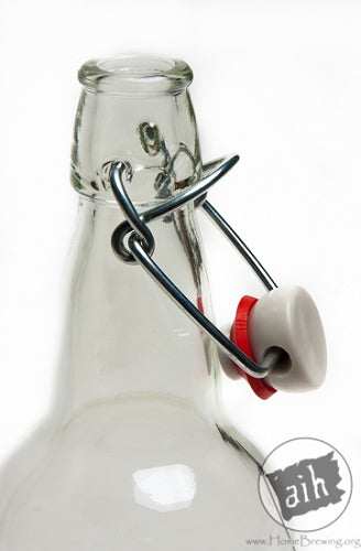 The neck of a clear E.Z. cap swing top beer bottle. 
